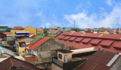 Rooftop view of colorful townhouses in the Cambodian countryside in Kampot Province in southern Cambodia, Asia. 