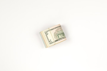 Stack of USA 5 dollars isolated on white background.