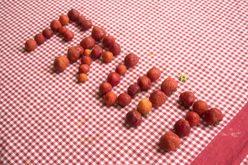 the writing fruit made with the strawberries