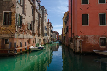 View of a canal of Venice with some boats