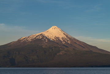 Beautiful sunset at a viewpoint in Ensenada located opposite the Osorno volcano, Puerto Varas,...