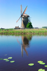 dutch windmill over river waters