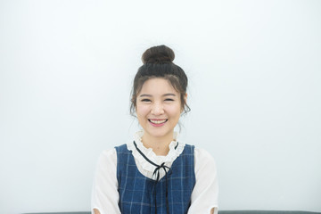 Happy cheerful young woman looking at camera with joyful and charming smile