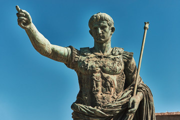 Rome, Bronze statue of emperor Caesar Augustus, Forum of Augustus in the background