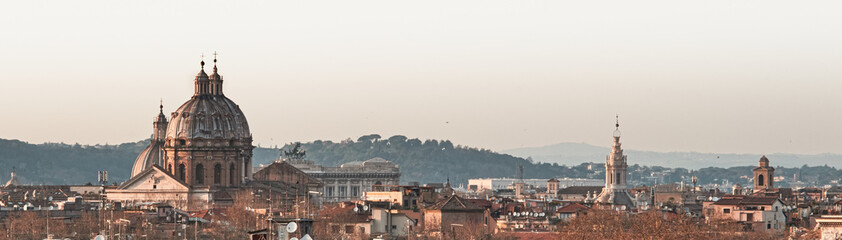 View of Rome roofs: Spire of Saint Ivo alla Sapienza, Towerbell of Saint Augustine Church, church dome of San Carlo at Cantinari, Sant'Andrea of Valle Sant'Agnese in Agone
