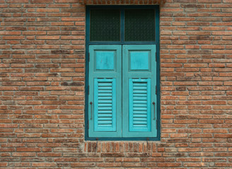 Striped brick walls and wooden window is used as the background.