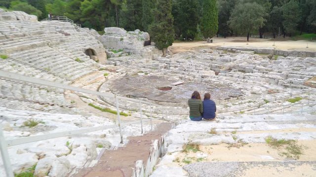 2636_Two_ladies_sitting_down_on_the_ampitheater_in_Siracusa_Sicily_Italy.mov