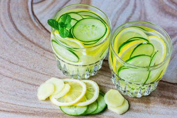 Fruit dietary sassi water with lemon, cucumber, ginger and mint. Detox water. Selective focus. The concept of a healthy diet