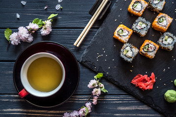 Obraz na płótnie Canvas tea, sakura and sushi