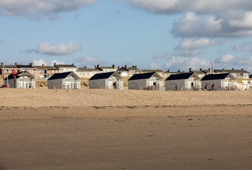   Row white beach houses at the Dutch coast in Katwijk, Netherlands