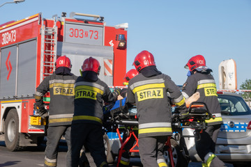 Obraz premium Szczecin, Poland-May 13, 2018: police, fire brigade and medical services during a rescue operation after drowning in a river