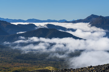 landscape from the heights of the Antillanca volcano, you can see the clouds of dawn entering through the valleys, south of Chile