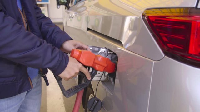 refueling a car with unleaded petrol