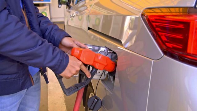 refueling a car with unleaded petrol