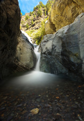 Fototapeta na wymiar Small waterfall in caldera of Taburiente, island of La Palma, Canary Islands