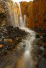 Fototapeta na wymiar Waterfall of Cascada de los Colores in caldera of Taburiente, island of La Palma, Canary Islands