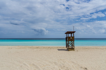 Fototapeta na wymiar Mallorca, Lifeguard house on empty perfect white sand beach of paradise island