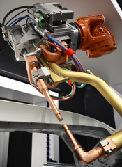 Close up of car spot welding robot detail