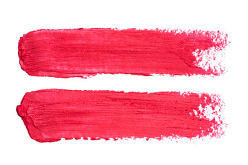 Photo of red lipstick smudges isolated on white background. Smudged makeup product sample. © Ludaiv