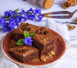 chocolate brownie pie in a ceramic brown plate