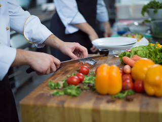 Chef hands preparing marinated Salmon fish