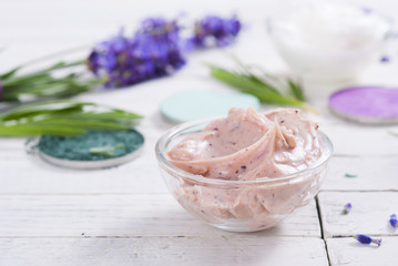 grooming products and fresh lavender bouquet on white wooden table background