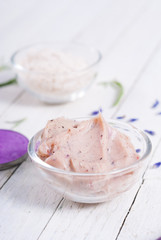 grooming products and fresh lavender bouquet on white wooden table background
