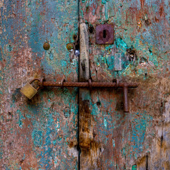Old wood door with iron lock.