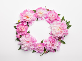 Flowers composition. Wreath made of pink peony flowers on white background. Flat lay, top view.