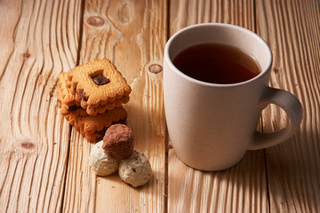 tee and cookies on a wooden table