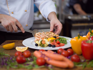 cook chef decorating garnishing prepared meal