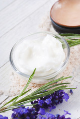 cosmetic cream and lavender on white wood table background