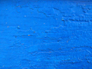 Texture of a blue wooden surface, abstract colored background of an old painted wood, blue natural pattern for a designer, minimalistic background
