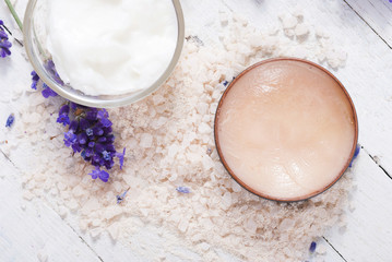 cosmetic cream, makeup base and lavender on white wood table background