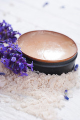 Obraz na płótnie Canvas makeup base, bath salt and lavender on white wood table background
