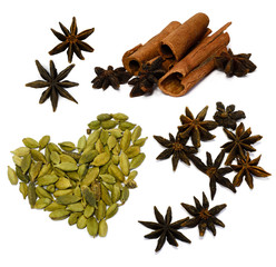 A collection of three kinds of spices isolated on a white background. Set of whole fruit of cardamom, star anise and cinnamon sticks