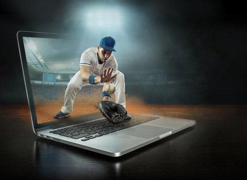 Caucasian baseball Players in dynamic action with ball 