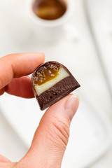 Cut handmade bonbon in hand