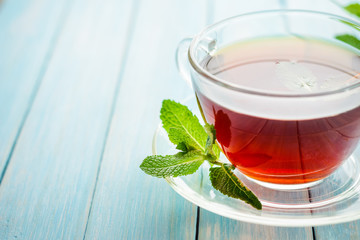 cup of black tea with fresh mint