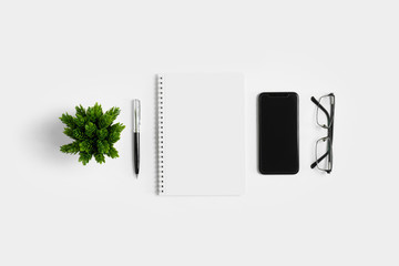 Work space from top view on white background. Minimal simplicity flat lay with copy space.