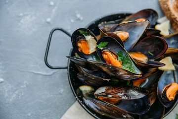 Shellfish Mussels with lemon and herbs. Shellfish seafood. Top view.