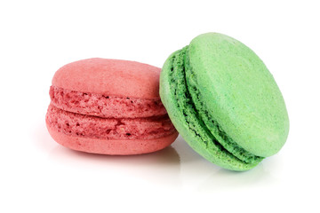 green and red macaroon isolated on white background closeup