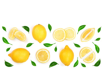 Naklejka na ściany i meble Lemon decorated with green leaves isolated on white background with copy space for your text. . Top view. Flat lay
