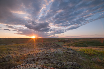 Fototapeta premium Sunrise over valley with clouds