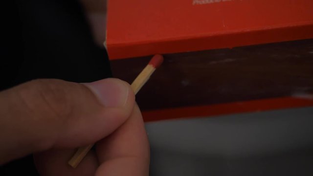 match ligting up in slowmotion