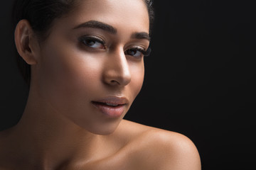 Close up of female face with long eyelashes looking at camera. Copy space in right side. Isolated...