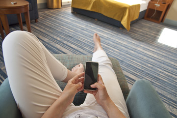 Woman with smartphone in hands - point of view