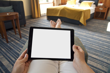 Woman with tablet pc in hands - point of view