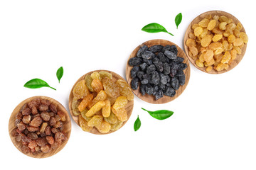 Collection of raisins in wooden bowl isolated on a white background with copy space for your text. Top view. Flat lay