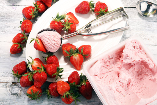 Delicious strawberry ice cream and waffle with fresh strawberries.